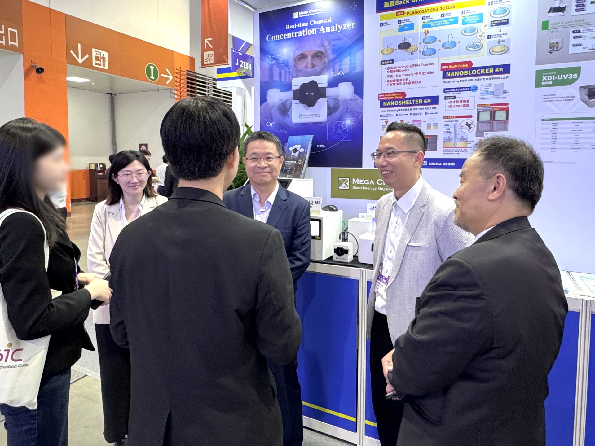 mega-crystal-booth-technical-discussion Mega Crystal Visitors engaging in technical discussions at our booth.